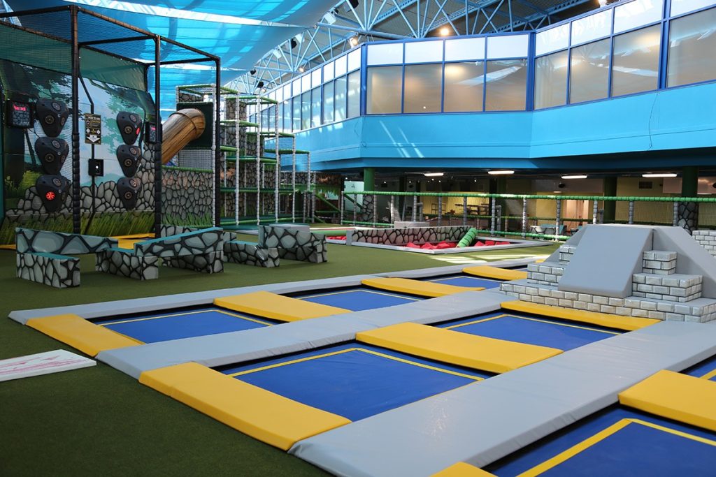 Soft play with trampolines which are yellow and blue